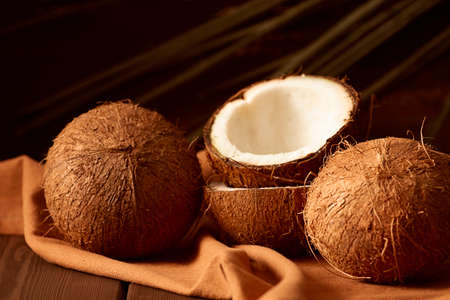 coconut, on a wooden brown background, top view,