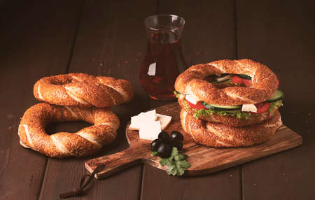 Traditional Turkish bagel simit, breakfast, on a wooden table, rustic, horizontal, no people,の写真素材