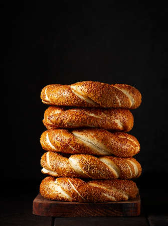 Traditional Turkish bagel simit, breakfast, on a wooden table, rustic, horizontal, no people,の写真素材