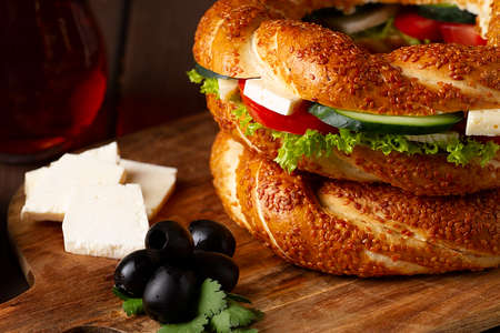Traditional Turkish bagel simit, breakfast, on a wooden table, rustic, horizontal, no people,の写真素材