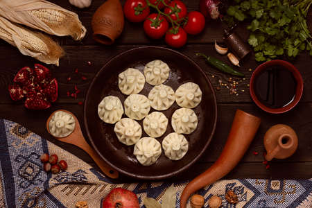 Traditional Georgian dish, khinkali Kalakuri, with national clay dishes, rustic, top view, no people,の写真素材