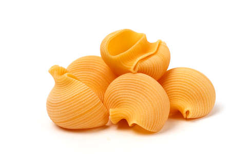 Raw pasta conciglioni large, on a white background, horizontal, no people,の写真素材