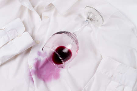 Wine glass, spilled, on a white shirt, no people, horizontal, concept, top view,の写真素材