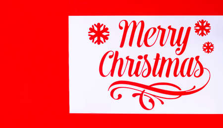 Stencil with the inscription Happy Christmas, on a red background, horizontally, without people, Christmas wallpaper,. High quality photoの写真素材