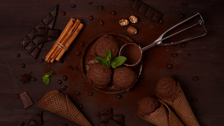 Chocolate ice cream, in a waffle chocolate cone, on a brown background, concept, top view, no people, horizontal,の写真素材