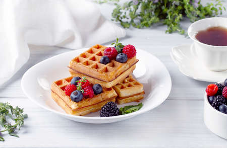 Viennese waffles, with berries, on a white table, breakfast, no people, horizontal,の写真素材