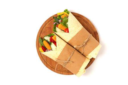 Tortilla wraps, with breaded chicken sticks with vegetables, burritos, on a white background, horizontal, no people,. high quality photoの写真素材