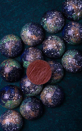 Food background Chocolates handmade, close-up, top view, on a dark background,wallpaper, vertical,...