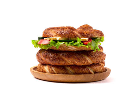 Traditional Turkish bagel simit breakfast, on a white background, horizontal, no people,