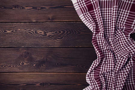 waffle towel white with brown cage, on a wooden brown table, top view, horizontal, no people,の写真素材
