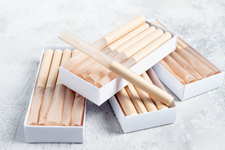 cigarette casings, packed in boxes, on the table, top view,