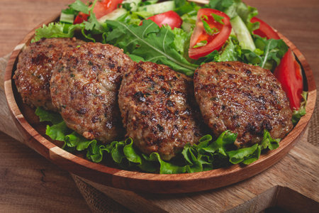 Fried cutlets, mixed minced meat, with vegetable salad, homemade, top view, no people,の写真素材