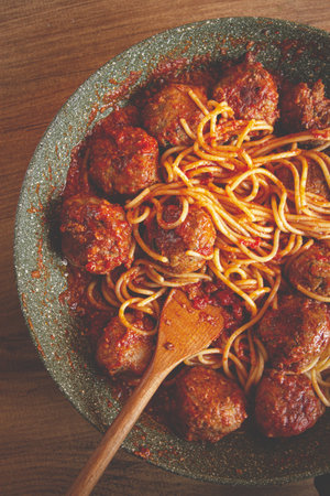 spaghetti with meatballs, in tomato sauce, cooking in a frying pan, no people, homemade,の写真素材