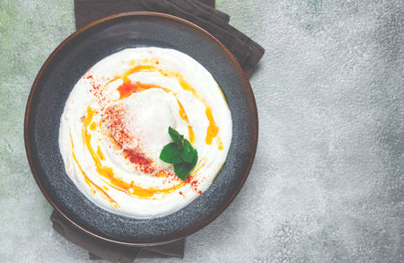 Ñilbir, traditional Turkish breakfast, Turkish eggs with yogurt and butter, homemade, no people,の写真素材