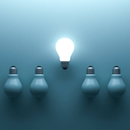One glowing light bulb standing out from the unlit incandescent bulbs on cyan background with shadow and reflection , individuality and different creative idea concepts . 3D rendering.の写真素材