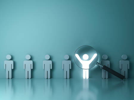 Searching for the right person concept, Stand out from the crowd and different concept , Magnifying glass focusing on the light man standing with arms wide open on green wall background. 3D rendering.の写真素材