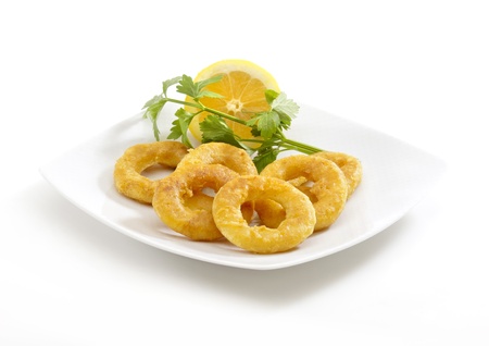 deep fried breaded calamari rings in a white backgroundの写真素材