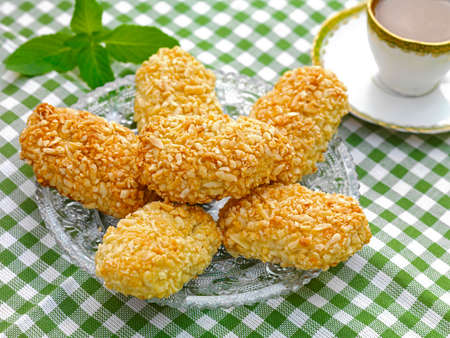 a traditional Greek sweet bite made of almond paste and covered with almond springles and honey.の写真素材