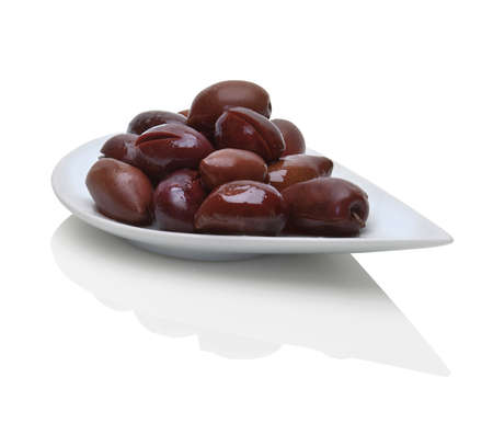 Kalamata black olives,preserved and ready to eat, in a modern white plateの写真素材