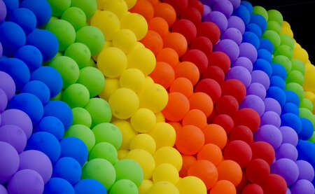 Abstract background of rainbow colored balloons.