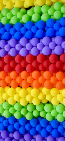 Abstract background of rainbow colored balloons.