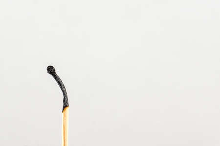 The burned-down match. Symbol of transience of time.の写真素材