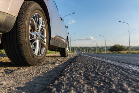 Modern passenger car is on the roadの写真素材