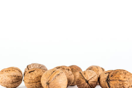 Walnuts. Nuts lying bunch on a white background.の写真素材