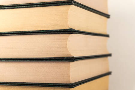 A stack of books lies on a white backgroundの写真素材