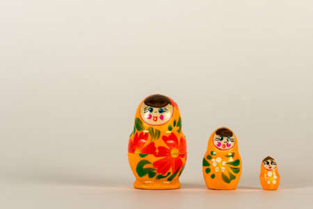 Little matryoshka standing on a white backgroundの写真素材