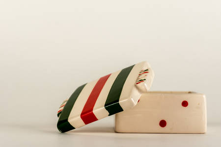 Porcelain casket lies on a white background