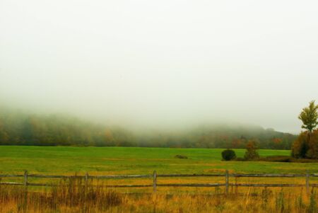 The fog settled in over a colorful fall valley in Canaan Valley, WV.の写真素材