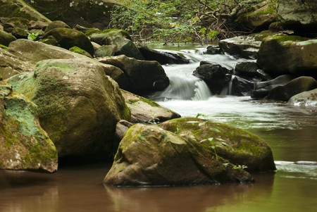 Small rapids along Roaring run stream that curves around large rocks.の写真素材