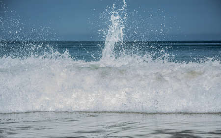 Seascape of ecuadorian shore with sand and rocks