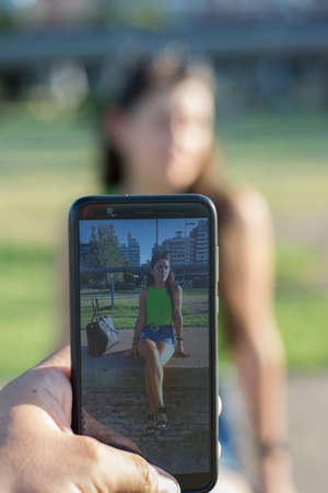 Woman portrait outdoors with green shirt in summer