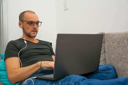 Man working in home office format during quarantineの写真素材