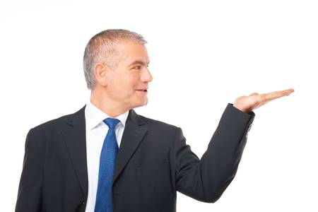 Happy mature businessman presenting something on his hand.

の写真素材