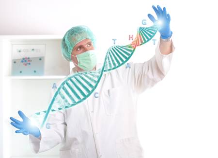 Researcher or a medic holding up a DNA strand. This could be also futuristic doctor using genetic engineering techniques known as recombinant DNA technology. の写真素材