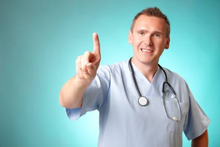 Medicine doctor pionting at something with his finger, space is left blank to add your text or graphicの写真素材