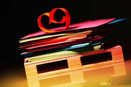 Colourful sheets of paper and a heart on the bottom deck board