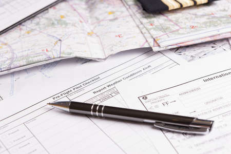Close up of an airplane pilot equipment and flightplannig papersの写真素材