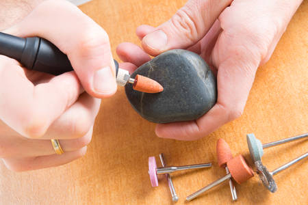 Using a high speed rotary multi tool to cutting and polishing on the stone