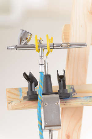 Professional airbrush on a standの写真素材