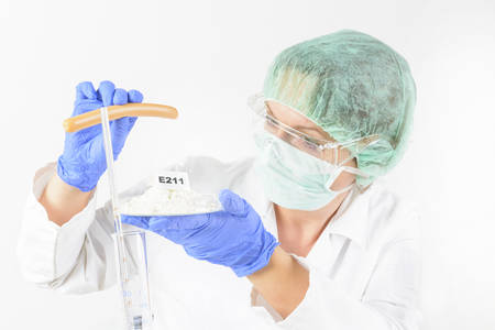 Researcher presenting preservatives substances that are added to products such as foods,...