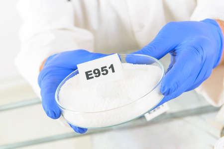 Researcher presenting preservatives substances that are added to products such as foods,...