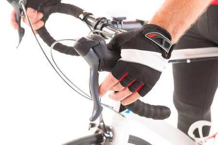 Hand in glove shifting bicycle's gearsの写真素材