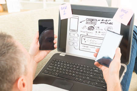 Designer working at new mobile applicationsの写真素材