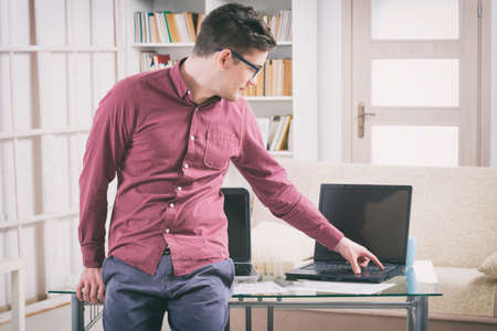 Designer or programmer working at home with new mobile applications