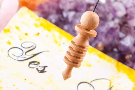 Pendulum, tool for dowsing over yes and no choosing diagramの写真素材