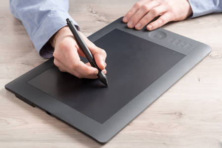 Man using modern graphical tabletの写真素材